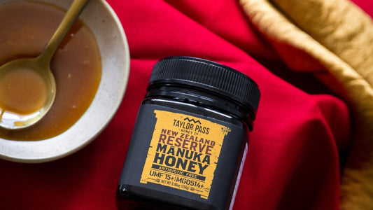 Jar of honey with small dish