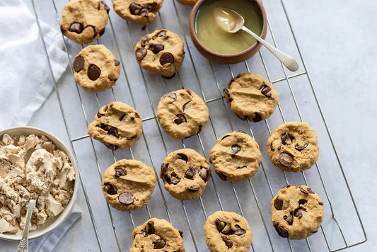 cookies on wire tray with bowl of honey