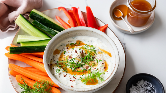Taylor Pass Mānuka Honey Pickle Gut Health Dip with freshly sliced carrot, bell peppers, herbs.