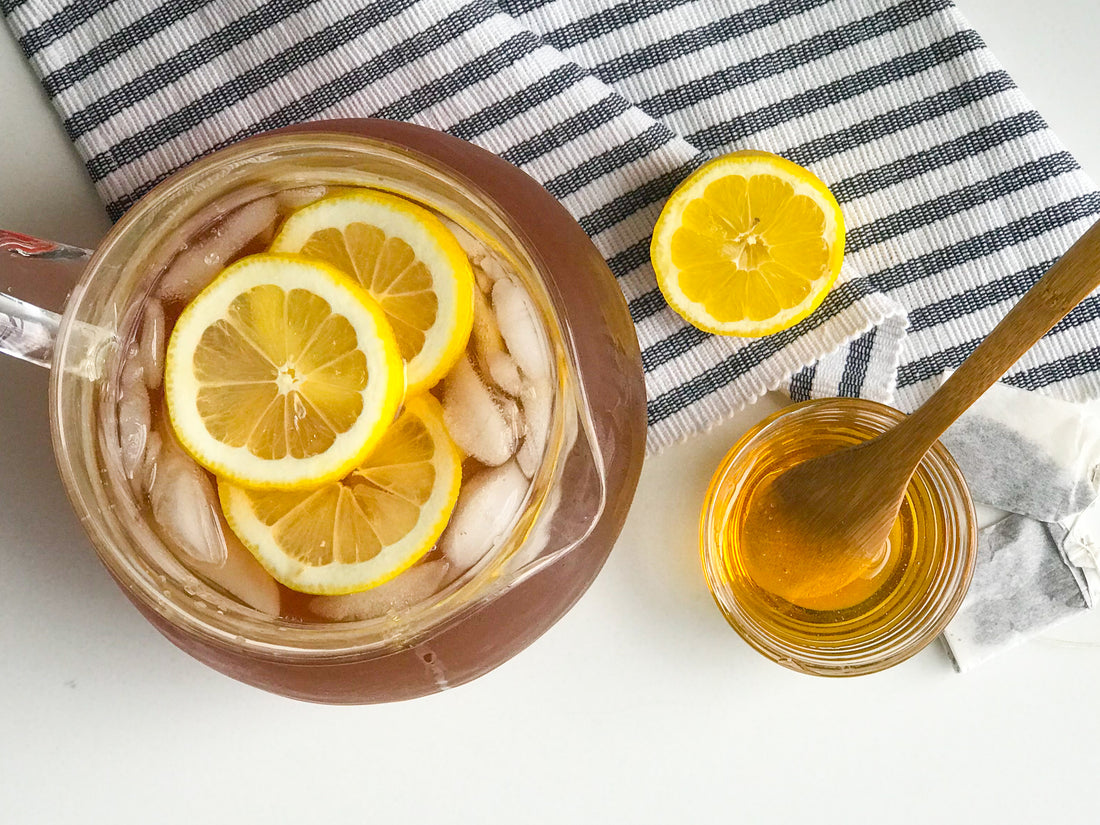 iced tea pitcher with lemons and honey